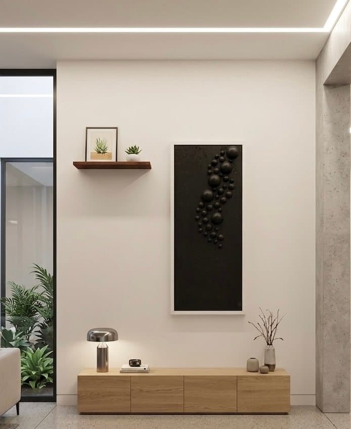 Tall dark panel with dozens of black three-dimensional spheres in relief.